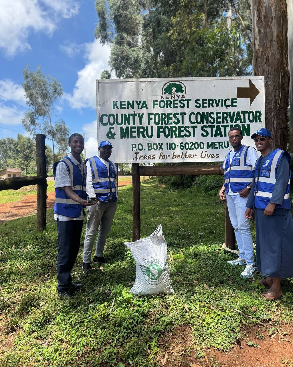 Community members planting seedballs in Meru County